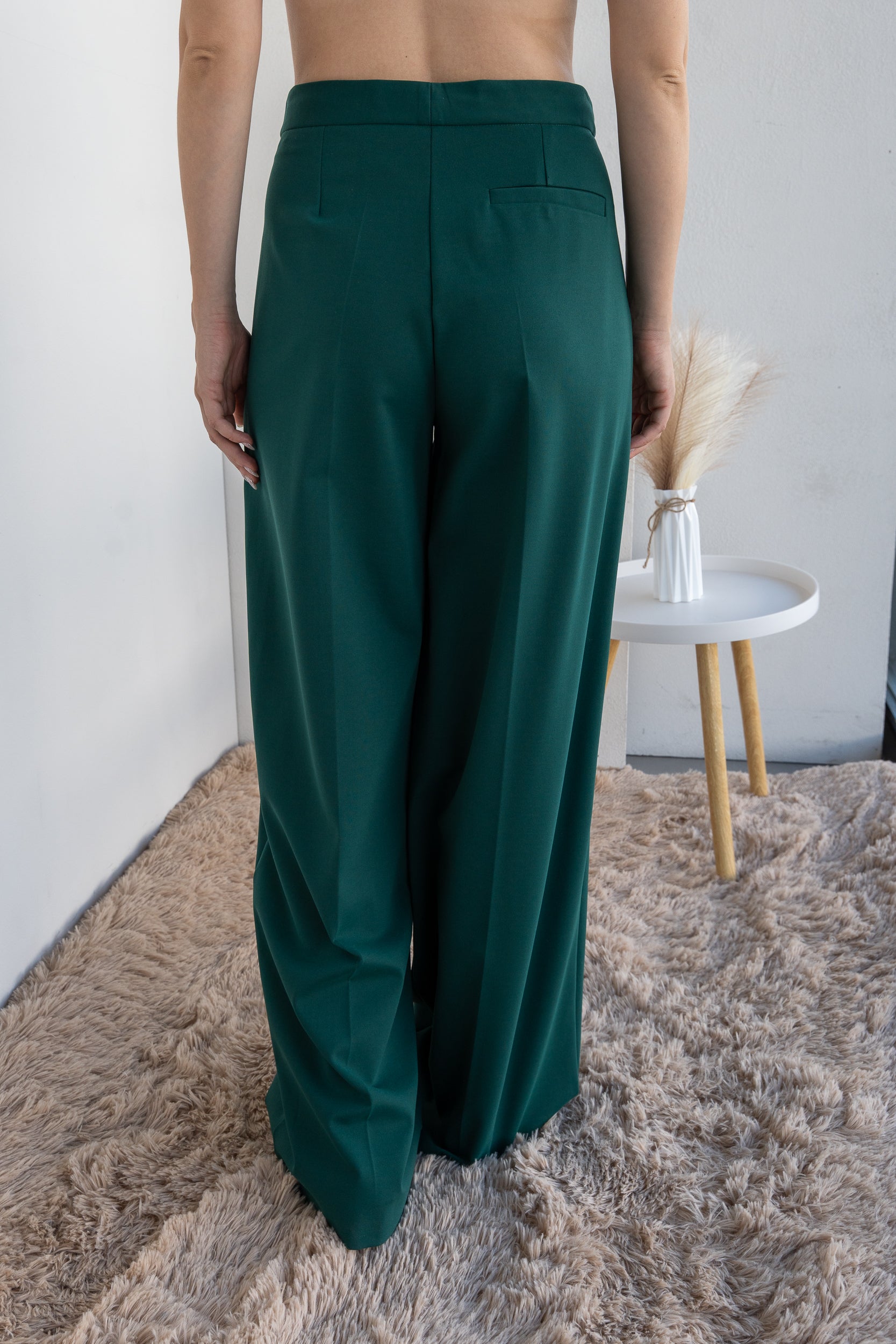 Trousers with pleats