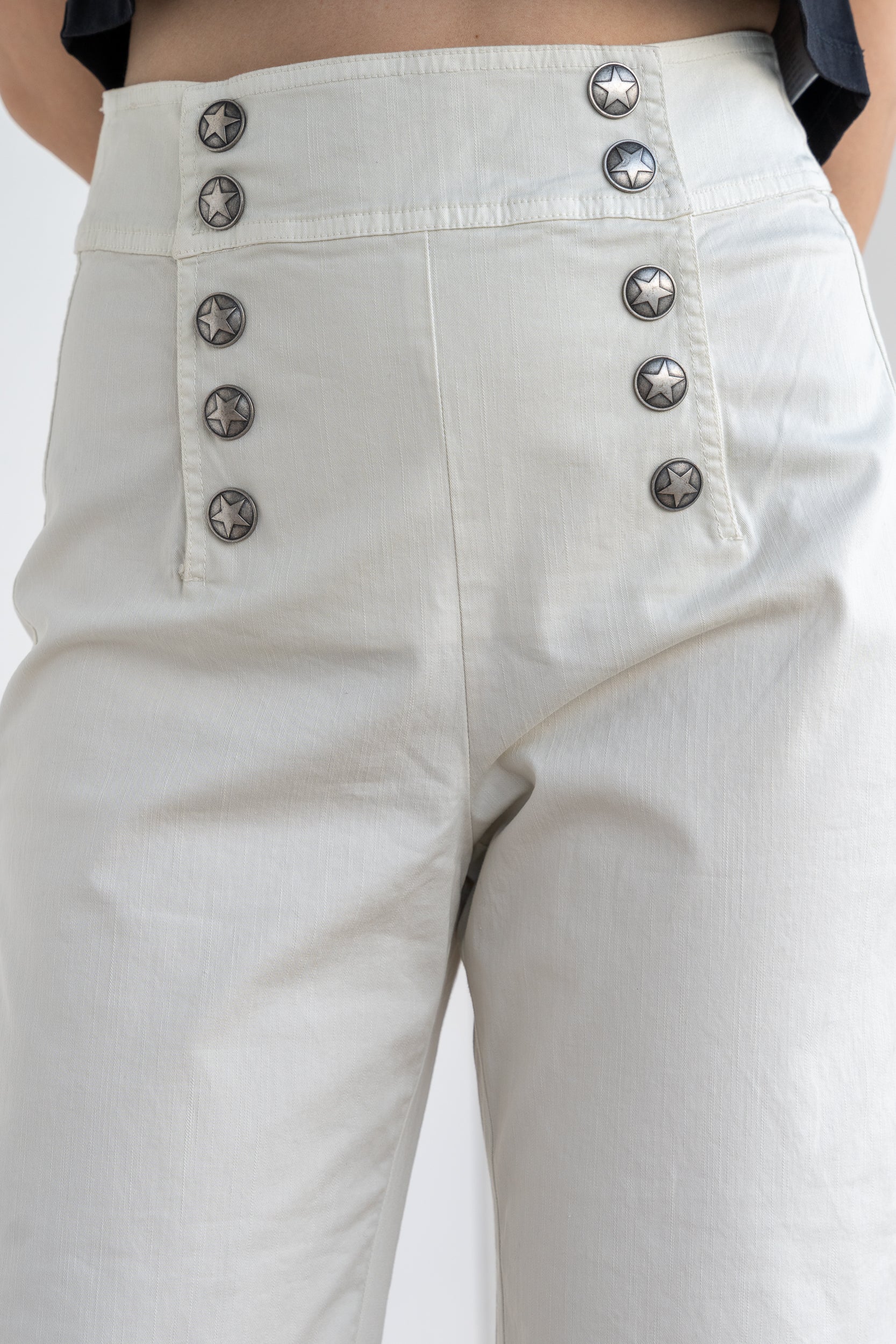 Trousers with double fastening