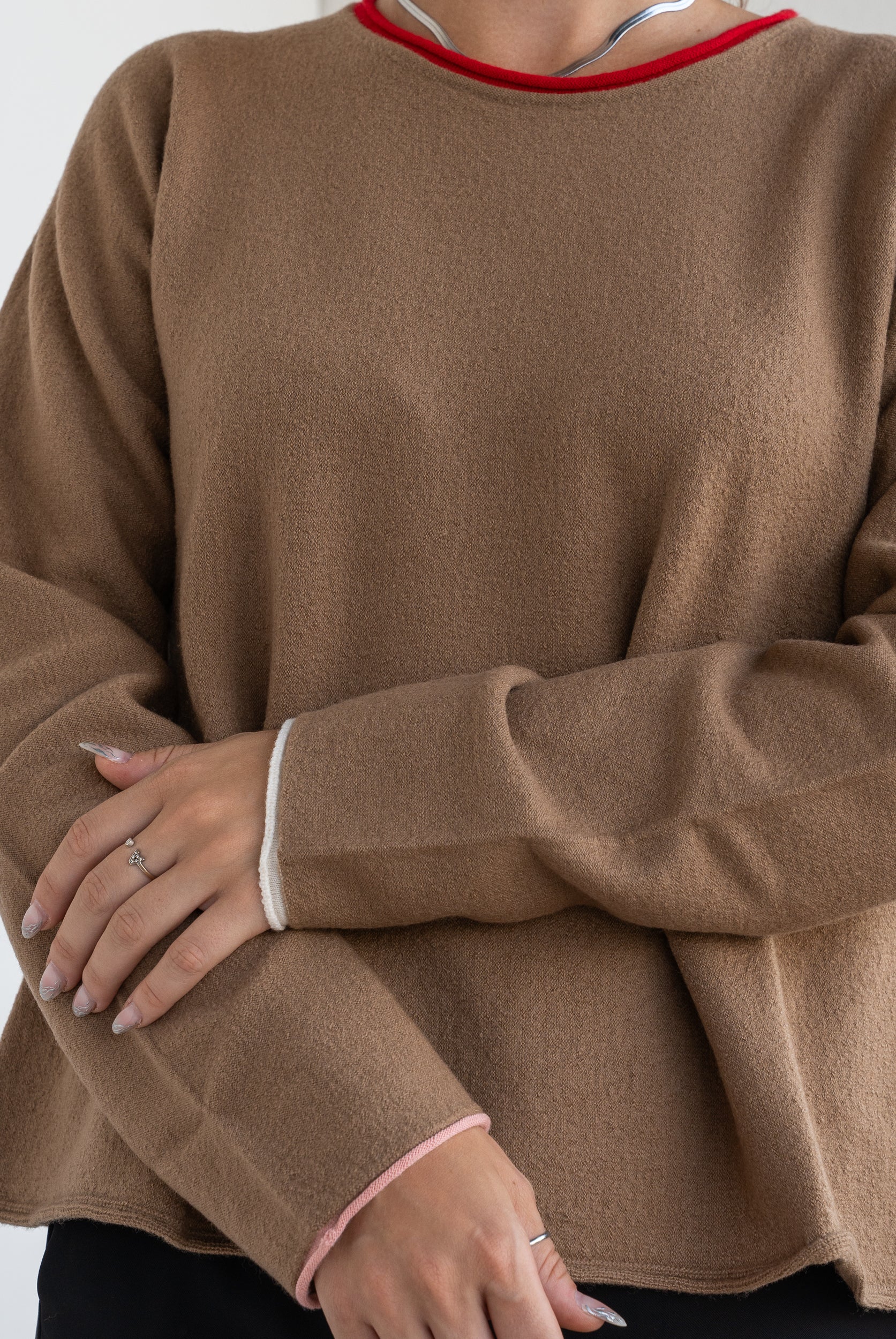 Sweater with contrasting edges