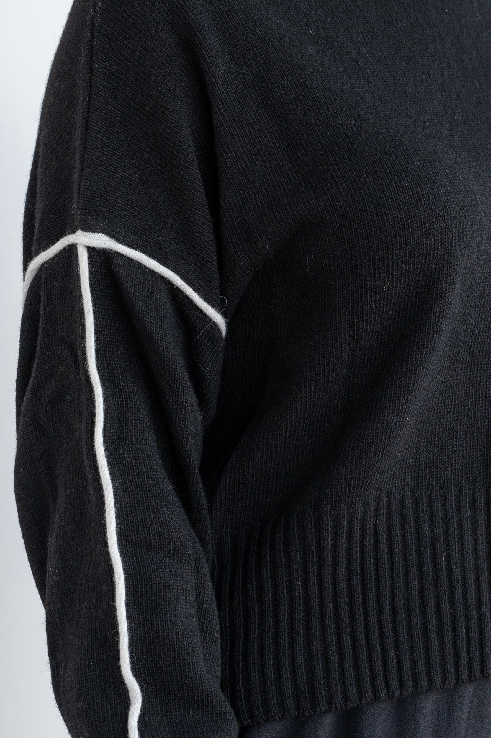 Sweater with contrasting lines