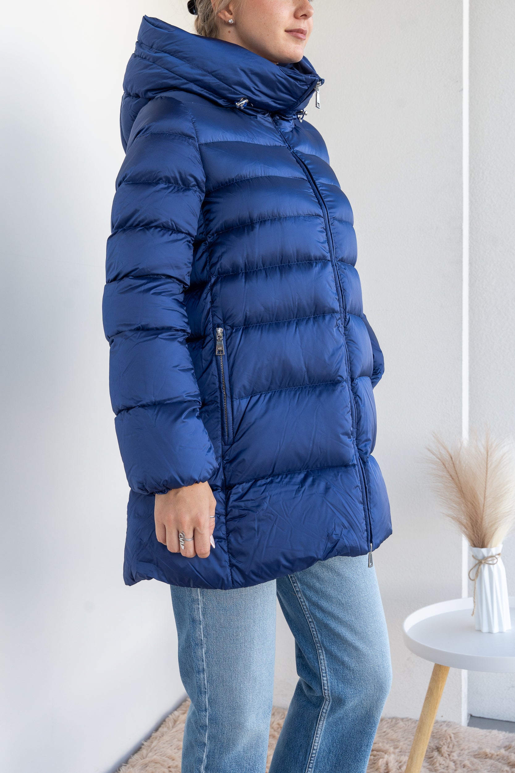 Down jacket with suspenders
