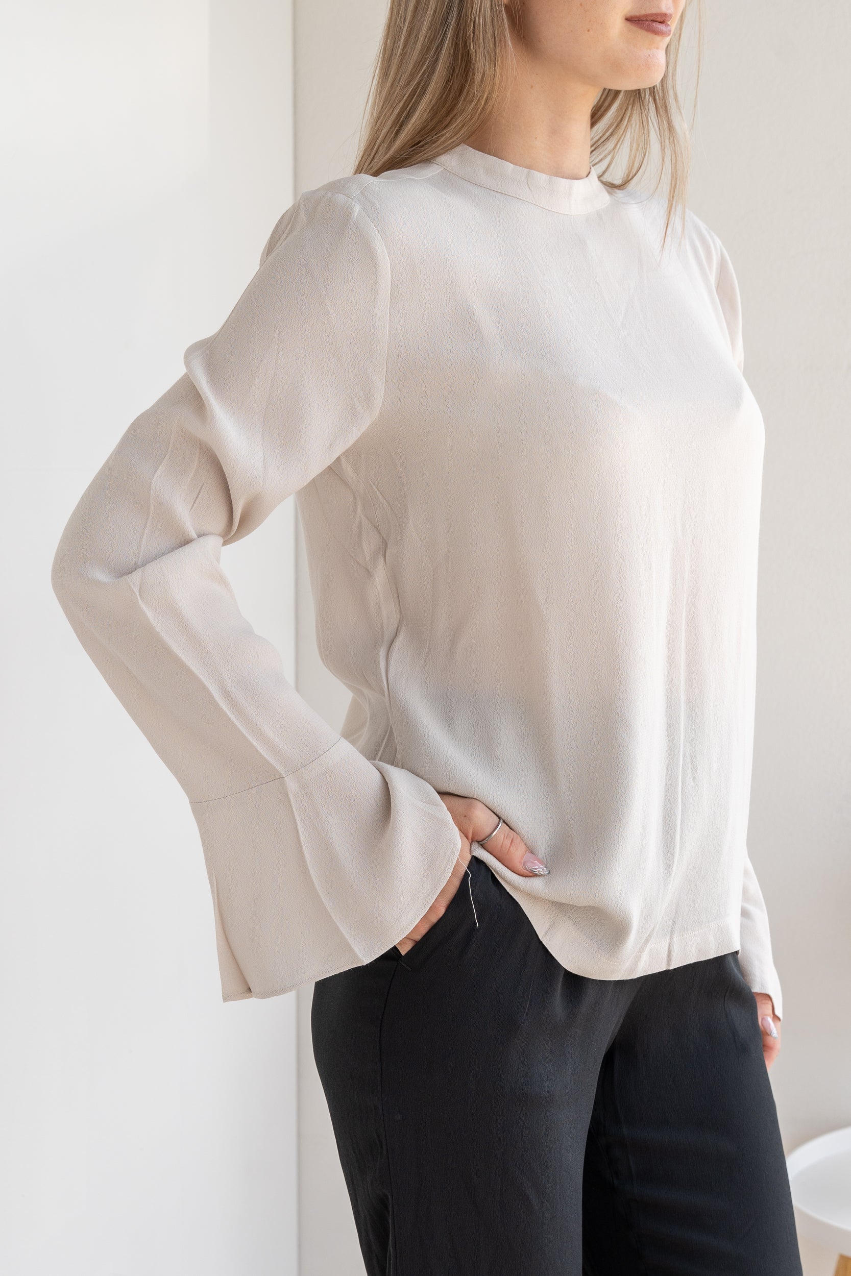 Blusa con polsino ampio