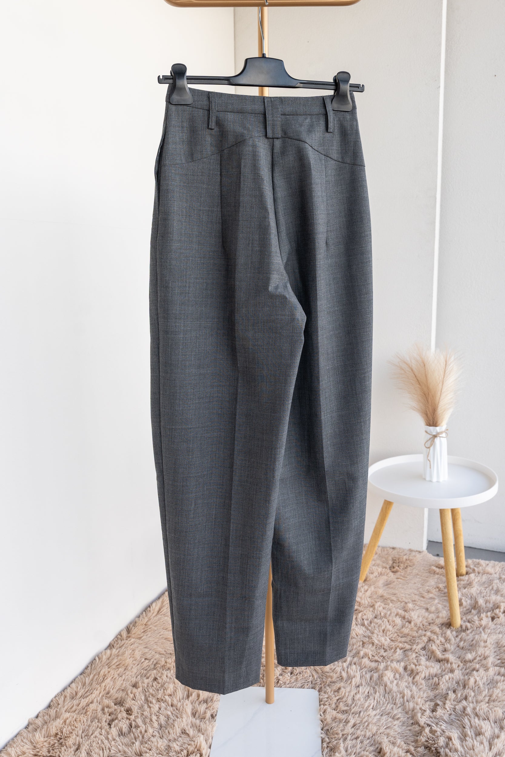 Trousers with pleats