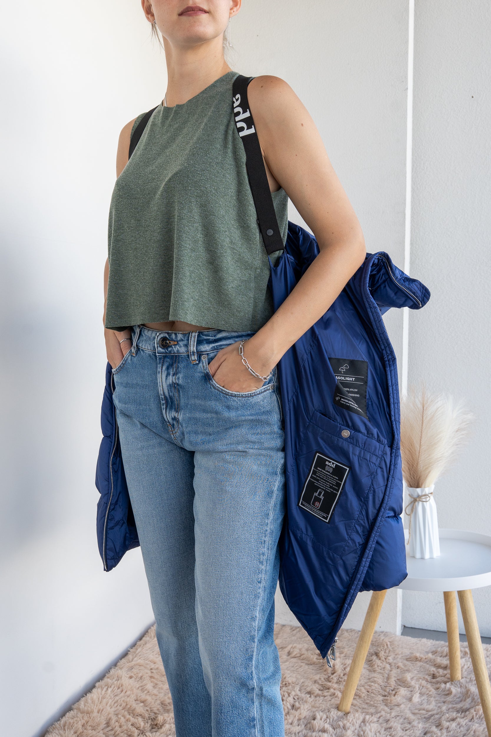 Down jacket with suspenders